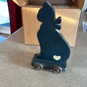 Vintage wooden cat toy on wheel wheels